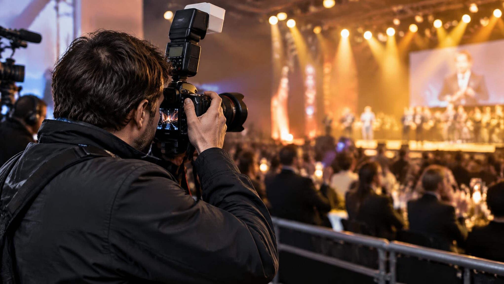 Press photographer with a professional camera covering an event